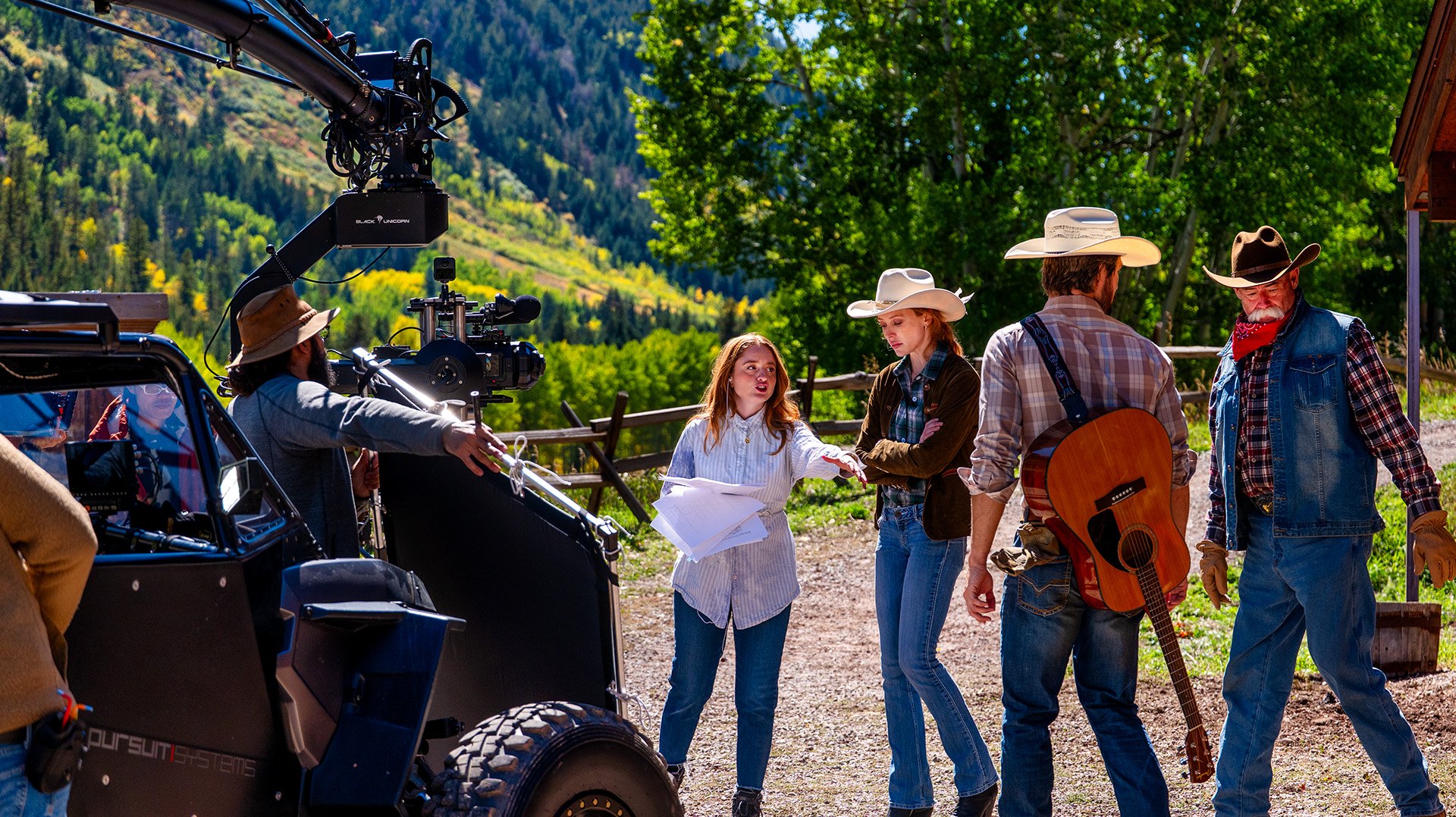 Behind the scenes on Aspen Cowgirl — camera crane and crew with the cast