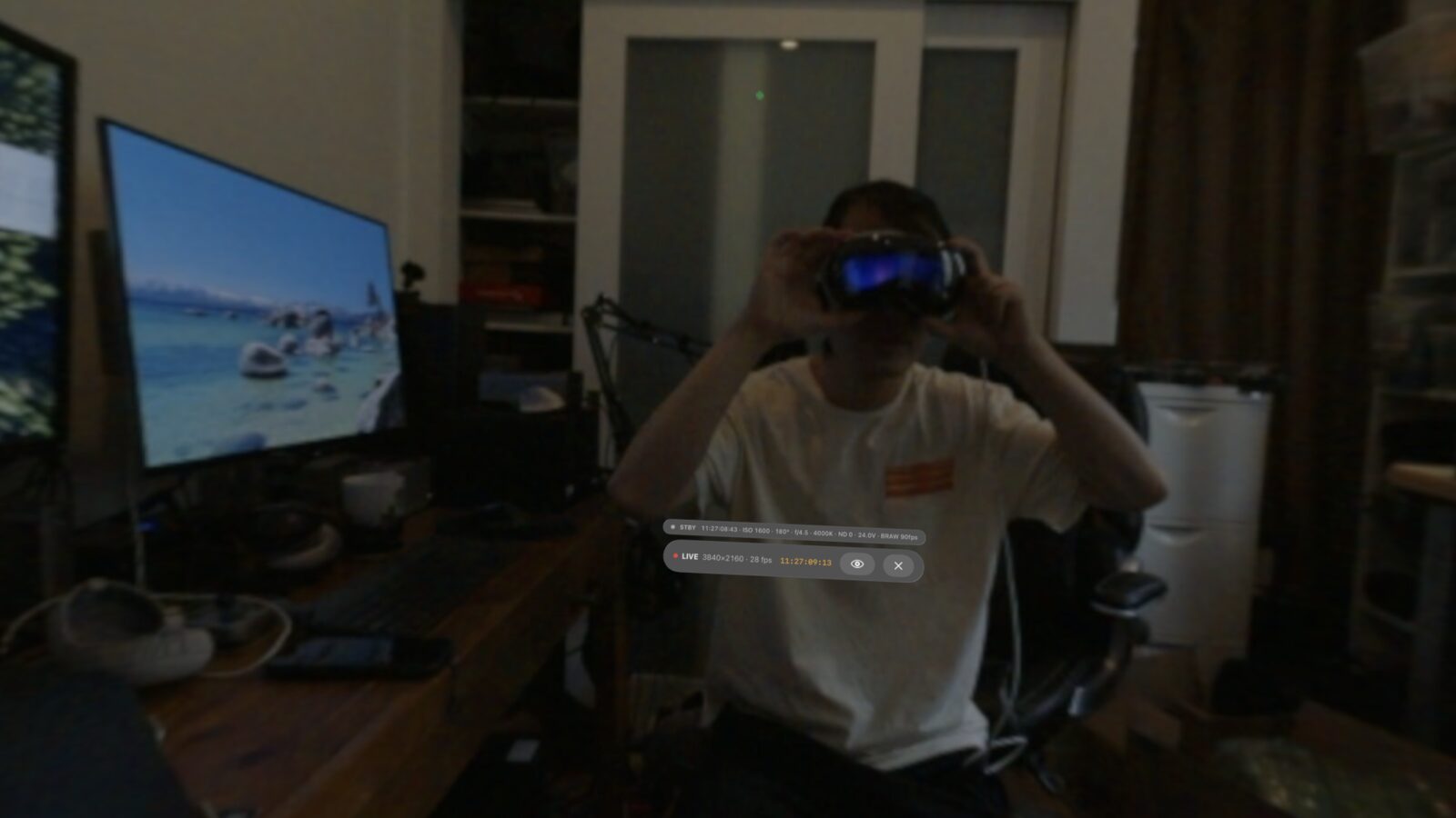 Standing inside the live URSA Cine Immersive feed on Apple Vision Pro, with the LIVE 4K status, timecode and Camera Link telemetry floating in view