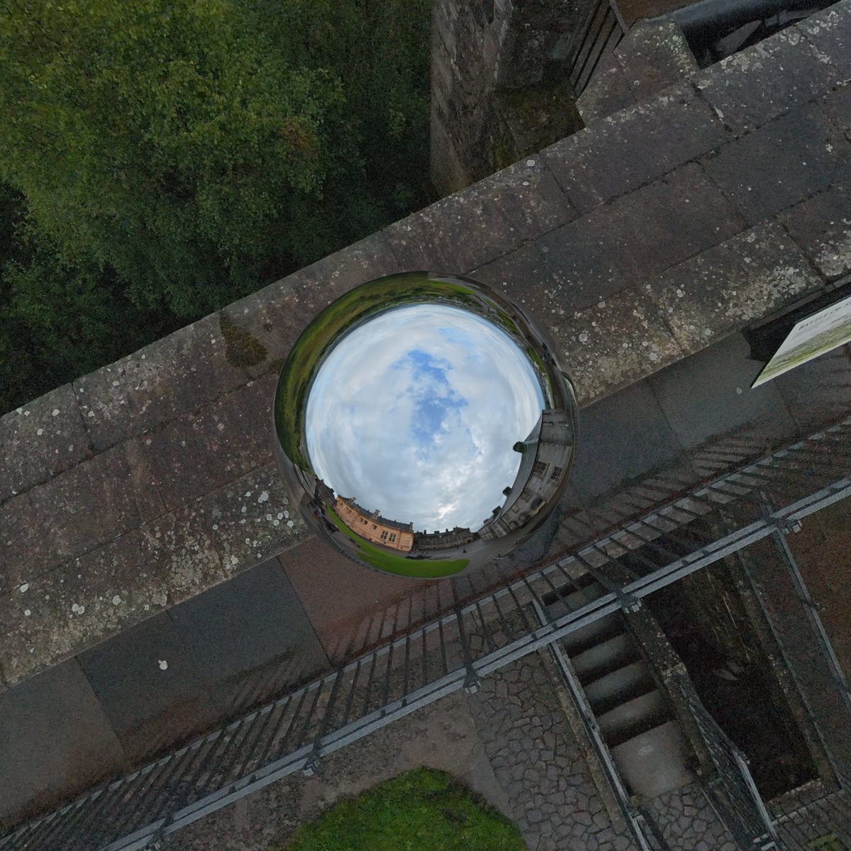 Seen straight down from a castle rampart: Spatial Film Chrome Ball covers the operator below the camera with a chrome ball that reflects the sky.