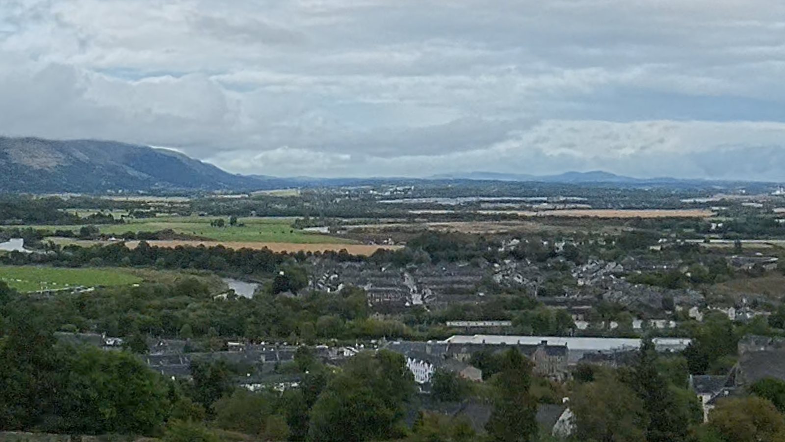 A 100 percent crop of the 16K frame: rooftops, the river and fields below the castle.